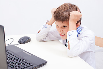 Image showing Boy using his laptop computer