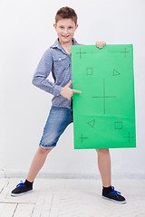 Image showing The boy holding a banner on white background