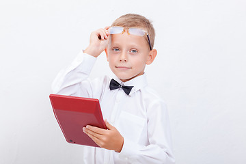 Image showing Portrait of teen boy with calculator on white background