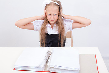 Image showing Schoolgirl with folders 