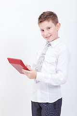 Image showing Portrait of teen boy with calculator on white background