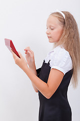 Image showing Portrait of teen girl with calculator on white background