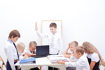 Image showing The group of teenagers sitting in a business meeting