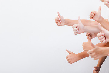 Image showing hands of teenagers showing okay sign on white 