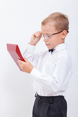 Image showing Portrait of teen boy with calculator on white background