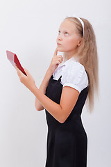 Image showing Portrait of teen girl with calculator on white background