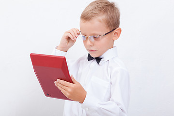 Image showing Portrait of teen boy with calculator on white background