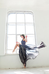 Image showing The beautiful ballerina posing in long gray dress 