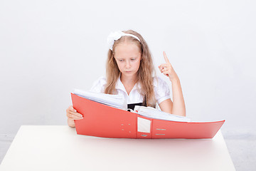 Image showing Schoolgirl with folders 