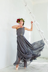 Image showing The beautiful ballerina dancing in long gray dress 