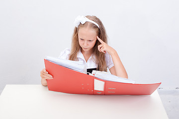 Image showing Schoolgirl with folders 