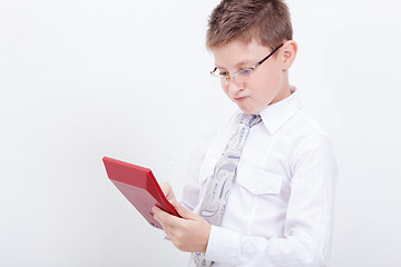 Image showing Portrait of teen boy with calculator on white background