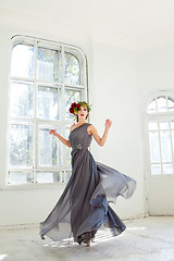 Image showing The beautiful ballerina dancing in long gray dress 