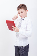 Image showing Portrait of teen boy with calculator on white background