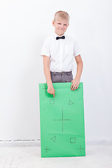 Image showing The boy holding a banner on white background