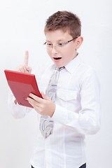 Image showing Portrait of teen boy with calculator on white background