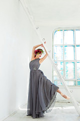 Image showing The beautiful ballerina posing in long gray dress 