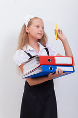 Image showing Schoolgirl with folders 