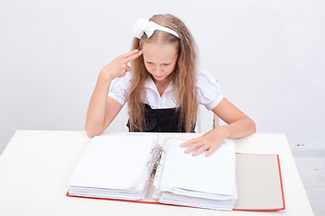 Image showing Schoolgirl with folders 