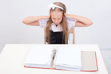 Image showing Schoolgirl with folders 