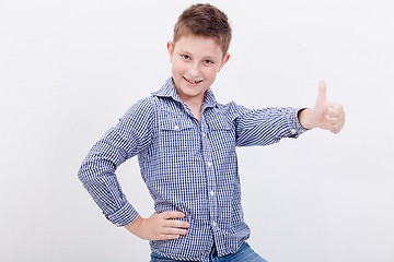 Image showing Portrait of happy boy showing thumb up gesture