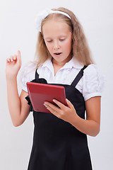 Image showing Portrait of teen girl with calculator on white background