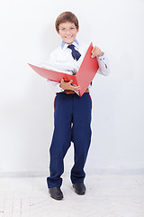 Image showing The boy with folders 