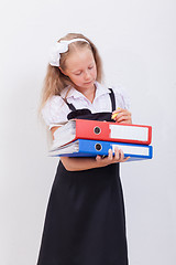 Image showing Schoolgirl with folders 