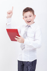 Image showing Portrait of teen boy with calculator on white background