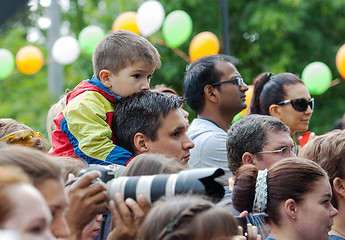 Image showing Father and son watching a concert