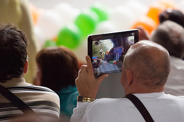 Image showing Senior man filming