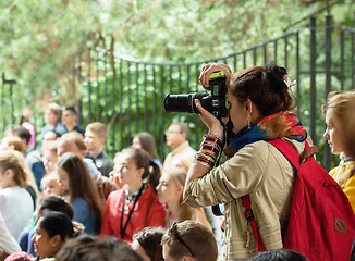 Image showing Girl photographer with bag