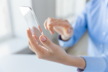 Image showing close up of woman with transparent smartphone