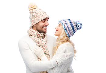 Image showing smiling couple in winter clothes hugging