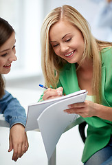 Image showing happy high school student girls with note book