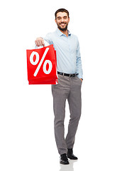 Image showing smiling man with red shopping bag