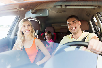 Image showing happy family with little child driving in car