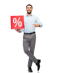 Image showing smiling man with red shopping bag