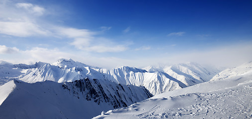 Image showing Panoramic view on snowy mountains at sun day