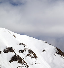 Image showing Winter mountains and sky with clouds at sun day