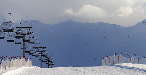 Image showing Panoramic view on snow skiing piste and ropeway