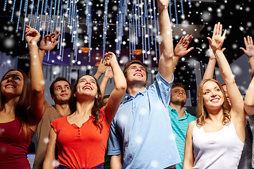 Image showing group of smiling friends at concert in club