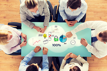 Image showing close up of business team sitting at table