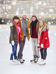 Image showing happy friends on skating rink