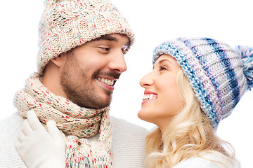 Image showing smiling couple in winter clothes hugging