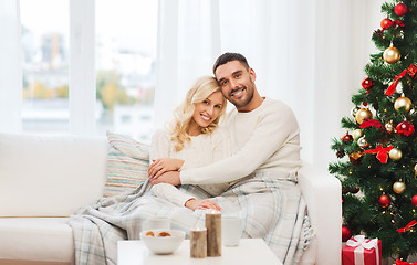 Image showing happy couple at home with christmas tree