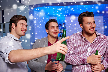 Image showing group of male friends with beer in nightclub