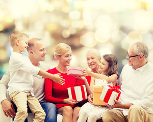 Image showing smiling family with gifts