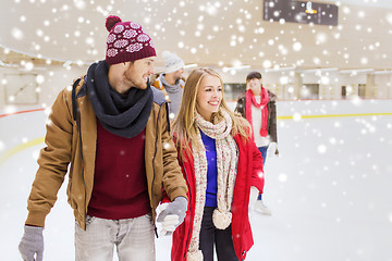 Image showing happy friends on skating rink