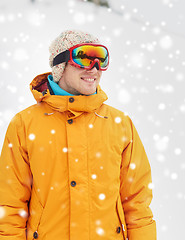 Image showing happy young man in ski goggles outdoors